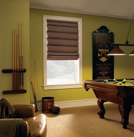 Roman shades in Minneapolis rec room with green walls.